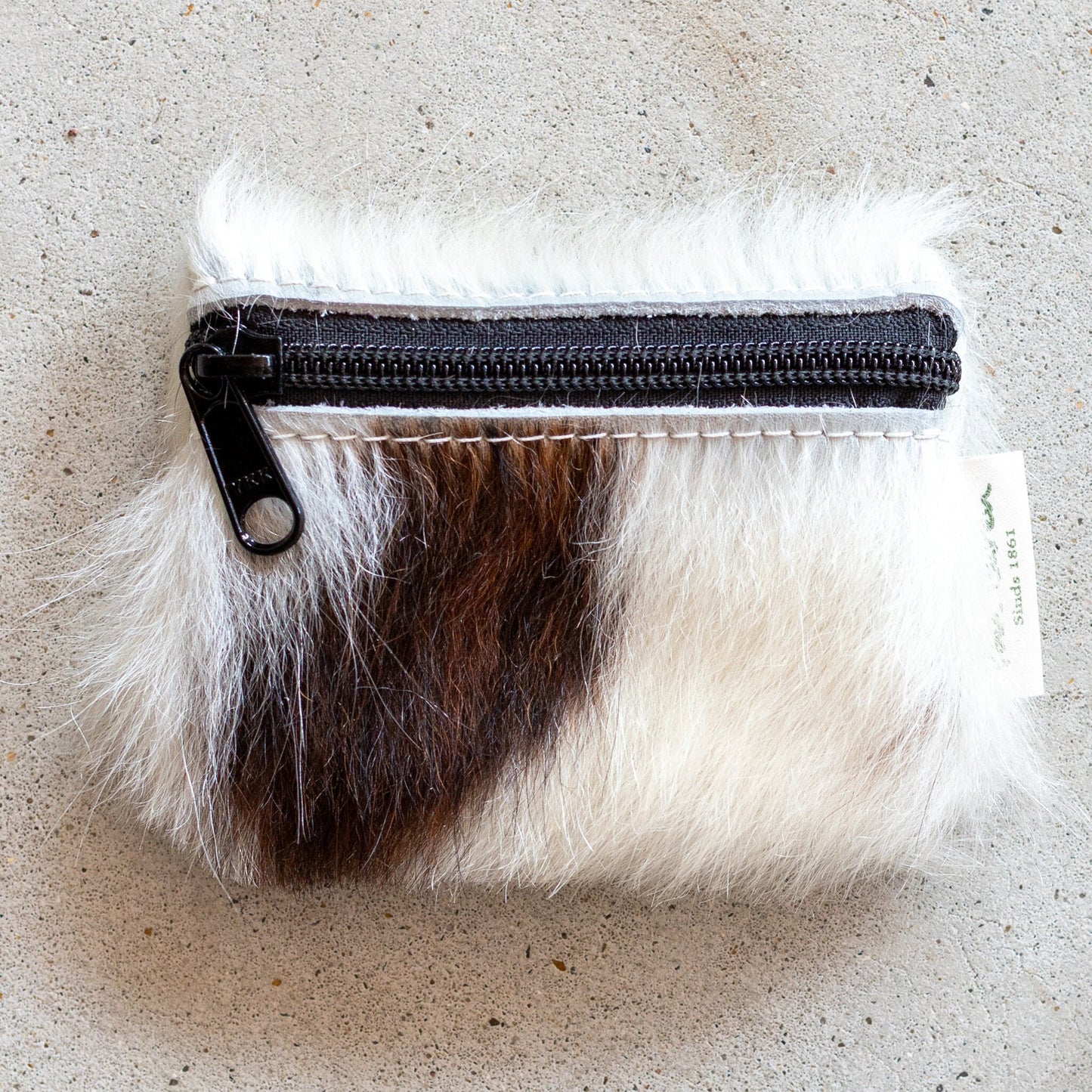 Portemonnee van koeienhuid met rits