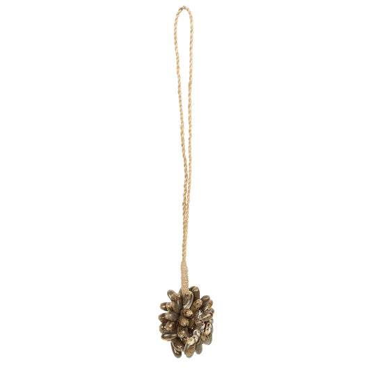 De bruine kauri schelp kwastje