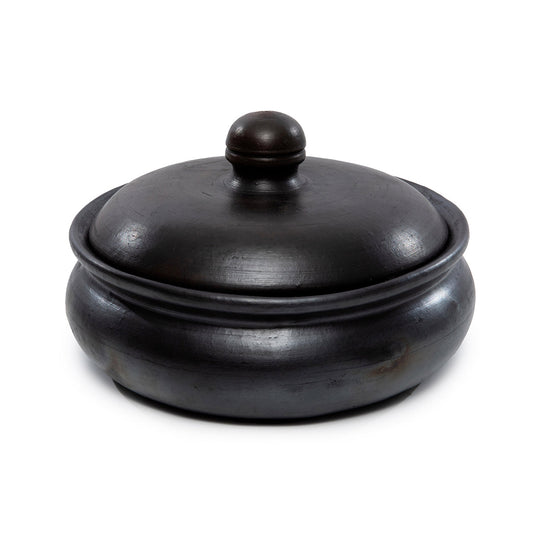 De verbrande curry-pot - zwart