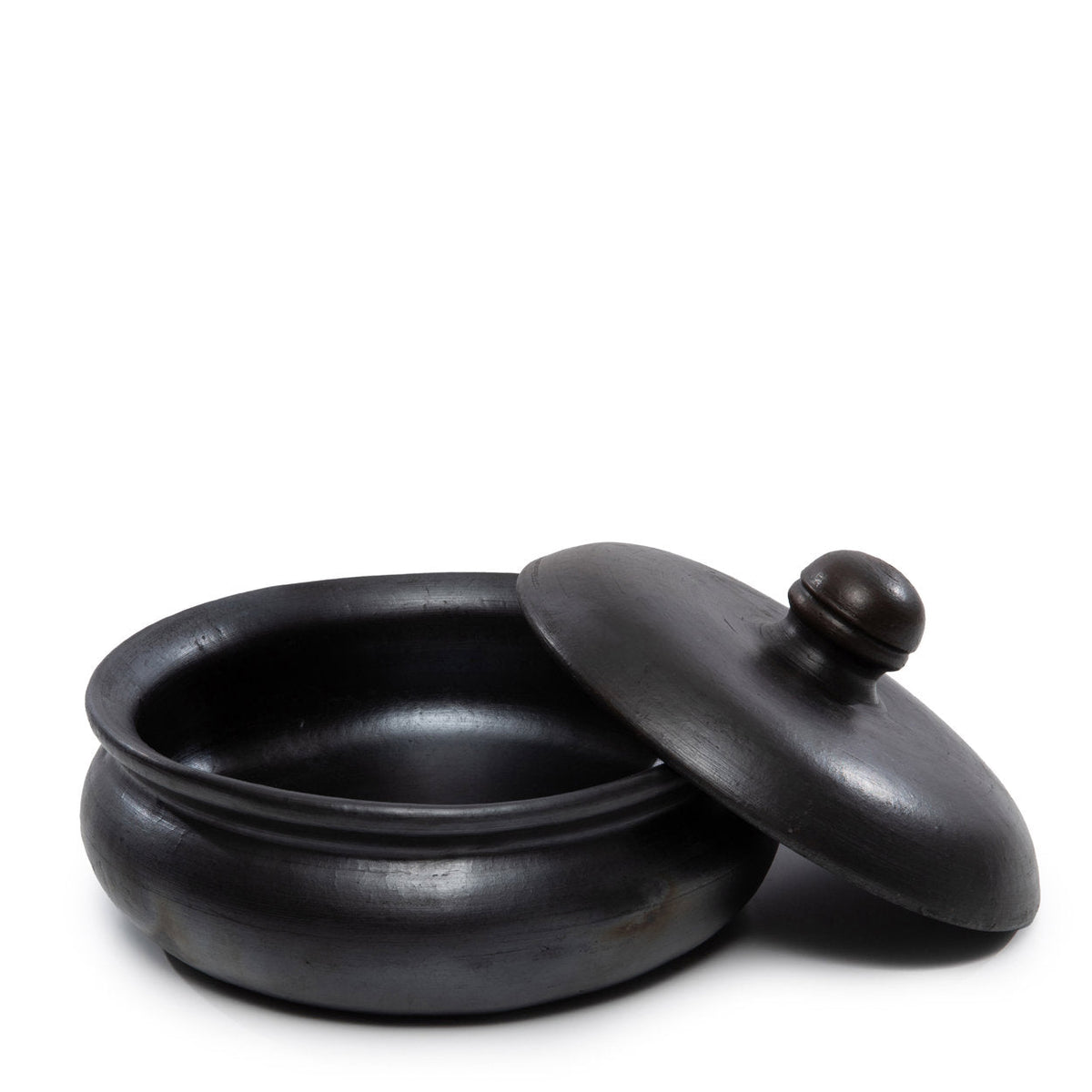 De verbrande curry-pot - zwart