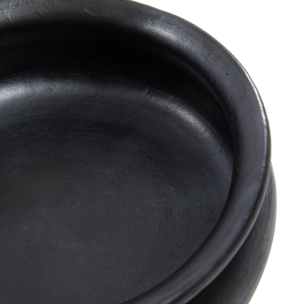 De verbrande curry-pot - zwart